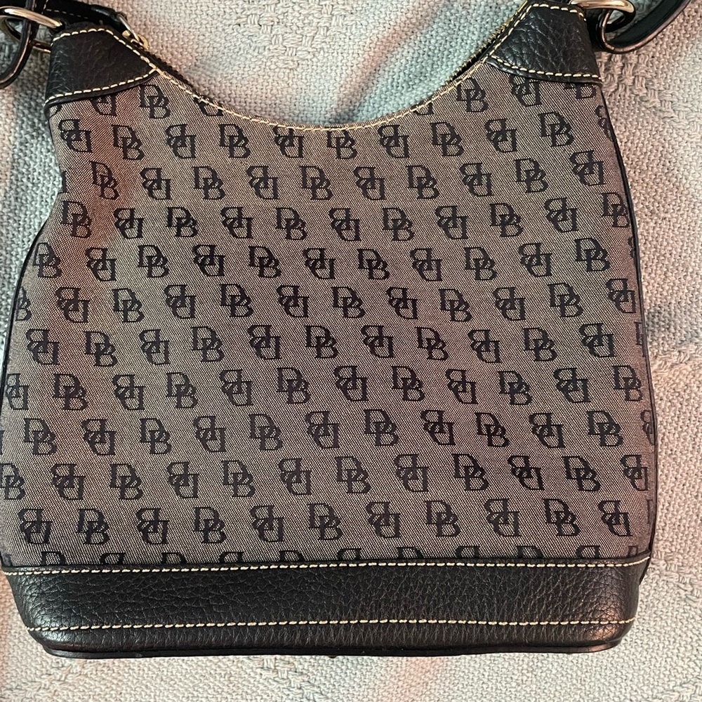 Vintage Dooney & Bourke adjustable shoulder and crossbody in signature monogram